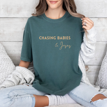 Load image into Gallery viewer, Chasing Babies and Jesus Tee (Multiple Colors)
